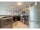 Well-equipped kitchen featuring stainless steel appliances, ample cabinet space, and granite countertops at 513 N Graham St # 3H, Charlotte, NC 28202