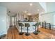 Charming kitchen area featuring an eat-in bar with overhead lighting and modern appliances at 513 N Graham St # 3H, Charlotte, NC 28202