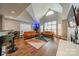 Bright living room featuring vaulted ceilings, two sofas, large windows, and modern decor at 513 N Graham St # 3H, Charlotte, NC 28202
