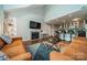 Bright living room featuring vaulted ceilings, fireplace, and views to the kitchen and dining areas at 513 N Graham St # 3H, Charlotte, NC 28202