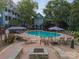 Relax by the pool with comfortable loungers and patio tables, perfect for enjoying sunny days at 513 N Graham St # 3H, Charlotte, NC 28202