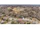 An aerial view captures the home's setting on a tree-lined street within a friendly neighborhood at 514 3Rd Avenue Se Dr, Hickory, NC 28602