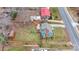 An aerial view reveals the layout of the house and its backyard space with mature trees at 514 3Rd Avenue Se Dr, Hickory, NC 28602