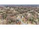 An aerial view shows the home's position amongst mature trees in an established residential area at 514 3Rd Avenue Se Dr, Hickory, NC 28602