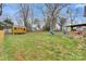 A large backyard featuring a storage shed, playset and a green lawn at 514 3Rd Avenue Se Dr, Hickory, NC 28602