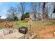 A spacious backyard featuring patio seating, play set, storage shed and a wood fence at 514 3Rd Avenue Se Dr, Hickory, NC 28602