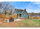 A spacious backyard featuring patio seating, play set and a wood fence at 514 3Rd Avenue Se Dr, Hickory, NC 28602
