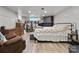 Finished basement with a bed, lounge chair, and exposed brick fireplace at 514 3Rd Avenue Se Dr, Hickory, NC 28602