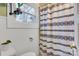 Bathroom featuring patterned shower curtain and a window with natural light at 514 3Rd Avenue Se Dr, Hickory, NC 28602