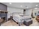 Bright bedroom featuring light wood flooring, brick fireplace, and a view of the gym at 514 3Rd Avenue Se Dr, Hickory, NC 28602