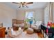 Bedroom featuring hardwood floors, a ceiling fan, a rocking chair, and plenty of natural light at 514 3Rd Avenue Se Dr, Hickory, NC 28602