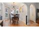 Cozy dining room featuring hardwood floors, a bay window, and a stylish sputnik light fixture at 514 3Rd Avenue Se Dr, Hickory, NC 28602