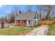 Quaint two-story home featuring a brick facade, gray roof, and well-kept lawn at 514 3Rd Avenue Se Dr, Hickory, NC 28602