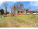 Charming brick and teal home with well-manicured lawn and a private driveway at 514 3Rd Avenue Se Dr, Hickory, NC 28602