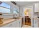 Kitchen featuring butcher block counters, stainless steel appliances, and adjacent dining room at 514 3Rd Avenue Se Dr, Hickory, NC 28602