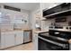 Kitchen featuring stainless steel appliances, butcher block counters, tile backsplash, and laminate flooring at 514 3Rd Avenue Se Dr, Hickory, NC 28602