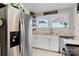 Updated kitchen featuring butcher block counters, stainless steel appliances, and charming open shelving at 514 3Rd Avenue Se Dr, Hickory, NC 28602