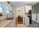 Bright kitchen featuring stainless steel appliances, butcher block counters, and an adjacent dining area at 514 3Rd Avenue Se Dr, Hickory, NC 28602