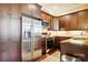 Well-equipped kitchen features stainless steel appliances and ample dark wood cabinets at 5425 Closeburn Rd # 309, Charlotte, NC 28210
