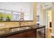 Kitchen showing the dark granite countertop, stainless steel sink and faucet at 5425 Closeburn Rd # 309, Charlotte, NC 28210
