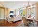 Bright living room boasts large windows, fireplace, hardwood floors and comfortable seating area at 5425 Closeburn Rd # 309, Charlotte, NC 28210