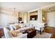 Bright living room featuring hardwood floors, neutral color palette, and stylish furnishings at 5425 Closeburn Rd # 309, Charlotte, NC 28210
