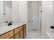 New bathroom with wood cabinets, black hardware, and marble floors at 558 Edmunds Ln # 41, Clover, SC 29710