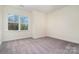 Bedroom with a view outside the window and neutral walls and carpet at 558 Edmunds Ln # 41, Clover, SC 29710