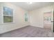 Bright bedroom with neutral tones, carpet flooring, and natural light from two windows at 558 Edmunds Ln # 41, Clover, SC 29710