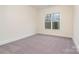 Bedroom with a large window and neutral carpet and paint at 558 Edmunds Ln # 41, Clover, SC 29710
