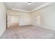 Large primary bedroom suite with plush carpet and a hallway that leads to the bathroom at 558 Edmunds Ln # 41, Clover, SC 29710