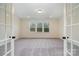 Bonus room with neutral walls and carpet, with french doors ahead at 558 Edmunds Ln # 41, Clover, SC 29710