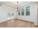 Dining room featuring hardwood floors, large windows, and access to the outdoor deck at 558 Edmunds Ln # 41, Clover, SC 29710