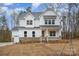 Beautiful two-story home with stone accents, front porch, well-manicured lawn and three-car garage at 558 Edmunds Ln # 41, Clover, SC 29710