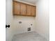 Functional laundry room with upper cabinets and tiled flooring at 558 Edmunds Ln # 41, Clover, SC 29710