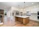 Spacious living room with hardwood floors, an island, and an open floor plan perfect for entertaining at 558 Edmunds Ln # 41, Clover, SC 29710