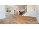 Bright living room featuring hardwood floors, white trim, and an open layout to the kitchen at 558 Edmunds Ln # 41, Clover, SC 29710