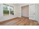 Bright office space featuring hardwood floors, glass doors and large window overlooking the property at 558 Edmunds Ln # 41, Clover, SC 29710