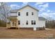 Back of home showcasing a two-story layout, a covered porch, and large windows at 558 Edmunds Ln # 41, Clover, SC 29710