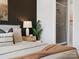 Comfortable bedroom featuring modern decor, a soft bed, and an ensuite bathroom with a glass shower at 5640 Kingspan Dr, Charlotte, NC 28217