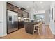 Modern kitchen with stainless steel appliances, a breakfast bar, and easy access to the dining area at 5640 Kingspan Dr, Charlotte, NC 28217