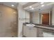 Bathroom featuring granite countertop, sink, and a glass-enclosed shower at 710 W Trade St # 309, Charlotte, NC 28202