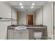 Stylish bathroom features a granite countertop, white cabinets, and modern fixtures at 710 W Trade St # 309, Charlotte, NC 28202