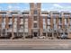 Street-level view of the apartment building with brick facade and balcony details at 710 W Trade St # 309, Charlotte, NC 28202