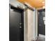 Apartment hallway with concrete pillar, doors and unit numbers at 710 W Trade St # 309, Charlotte, NC 28202