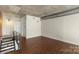 Living area featuring hardwood floors, a concrete ceiling, and a modern aesthetic at 710 W Trade St # 309, Charlotte, NC 28202
