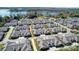 Stunning aerial view of a lakeside community with manicured lawns, gray roofs, and easy access to the lake at 8146 Viscount Ct, Denver, NC 28037