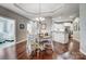 Open dining area with hardwood floors, stylish lighting, and seamless access to the kitchen at 8146 Viscount Ct, Denver, NC 28037