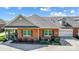 Charming brick home with a well-manicured lawn, black shutters, and an attached garage at 8146 Viscount Ct, Denver, NC 28037