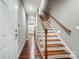Hallway with wood flooring and staircase at 8146 Viscount Ct, Denver, NC 28037